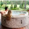 A couple relaxing in a hot tub outdoors. Náhled obrázku produktu