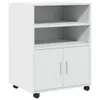 A white rolling cabinet with two doors and two open shelves. Podgląd zdjęcia produktu