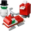 A collection of LEGO Christmas-themed models: a snowman, a snowmobile, and a mailbox. Náhled obrázku produktu