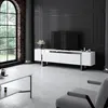 A modern living room with a TV stand, TV, coffee table, and armchair. Voir les images du produit