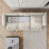 An overhead view of a modern living room setup featuring a sectional sofa, coffee table, and a decorative rug. Produktbild-Vorschau