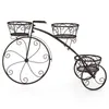 A decorative metal plant stand shaped like a bicycle. Anteprima dell’immagine prodotto