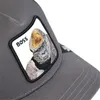 A close-up of a grey trucker cap with a patch featuring a gorilla and the word "BOSS". Produktbild-Vorschau