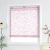 A pink Roman blind with a white floral pattern hangs in a window frame. Produktbild-Vorschau