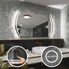 A modern bathroom vanity with a large LED mirror, sink, and faucet. Produktbild-Vorschau