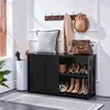 An entryway scene featuring a black storage cabinet with shoes and accessories. Produktbild-Vorschau