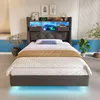 A modern bedroom with a bed and headboard featuring integrated lighting and storage. Produktbild-Vorschau