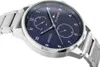 A close-up, angled shot of a Tommy Hilfiger watch with a blue dial and silver band. Produktbild-Vorschau