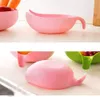 A collage of product images showing pink and green colanders or strainers for washing rice or vegetables. Produktbild-Vorschau