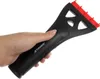 A hand holding a black and red ice scraper against a white background. Anteprima dell’immagine prodotto
