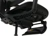 A close-up view of the underside of a black office chair, focusing on the mechanical components and a deployed footrest. Náhled obrázku produktu