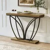 A console table with a wooden top and metal legs is placed in a hallway or living room, decorated with books, pinecones, and a vase with greenery. Podgląd zdjęcia produktu