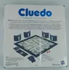 The back of a Cluedo Premium Collection board game box, showing the game board and components. Produktbild-Vorschau