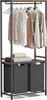 A clothing rack with clothes hanging on it, two shelves with folded towels, and two laundry baskets underneath. Produktbild-Vorschau
