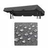 A close-up of a grey fabric with water droplets on it, and a grey swing canopy above. Podgląd zdjęcia produktu