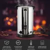 A stainless steel hot beverage dispenser with steam rising from the top, set against a blurred background of warm lights and festive decorations. Náhled obrázku produktu