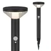 Two black solar garden lights with motion and dusk sensors are shown against a white background. One light is shown close-up, and the other is shown from a distance with its stake. Produktbild-Vorschau
