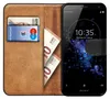 A brown leather flip case for a Sony Xperia XZ2 Compact phone, showing cards and euro banknotes inside. Náhľad obrázku produktu