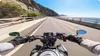 Riding a motorcycle on a scenic coastal road. Produktbild-Vorschau