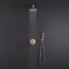 A gold-colored shower set with water running from the showerhead against a dark gray tiled wall. Anteprima dell’immagine prodotto