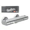 A product shot of a chrome shower faucet and its packaging. Produktbild-Vorschau