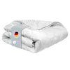 A folded white duvet with a label showing the German flag and OEKO-TEX certification. Produktbild-Vorschau
