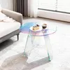 A round acrylic coffee table with iridescent colors is placed on a rug next to a sofa. A slice of cake and a cup of coffee are on the table. Anteprima dell’immagine prodotto
