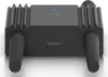 A product shot of a black network router on a reflective white and gray surface. Produktbild-Vorschau