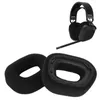 A pair of black headphone ear pads and a black headset are shown against a white background. Podgląd zdjęcia produktu