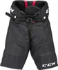 A pair of black hockey pants with red accents and white branding. Podgląd zdjęcia produktu