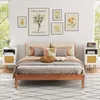 A bedroom scene with a bed, nightstands, and wall art. Náhled obrázku produktu