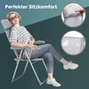 A woman is sitting in a gray folding chair on a teal and gray background. There are two circular insets showing close-ups of the chair's fabric. Produktbild-Vorschau