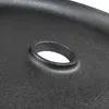 A close-up view of a black cast iron griddle with a central hole. Náhled obrázku produktu