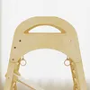 Close-up view of a wooden Montessori climbing structure for children, showing the top arch with a handle and hanging rings. Podgląd zdjęcia produktu