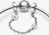 A close-up shot of a Pandora bracelet safety chain with daisy charms. Anteprima dell’immagine prodotto