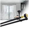 A double curtain rod with decorative finials is shown in the foreground, with a window and sheer curtains in the background. Anteprima dell’immagine prodotto