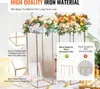Two gold metal flower stands with floral arrangements on top, set against a light background with some decorative elements and balloons. Produktbild-Vorschau
