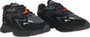 A pair of black and gray Lacoste sneakers with orange accents, shown from a diagonal view against a white background. Anteprima dell’immagine prodotto