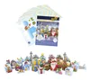 A collection of Christmas-themed paper crafts and a printed sheet showing a winter village scene. Anteprima dell’immagine prodotto