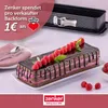 A chocolate cake with raspberries and mint leaves, next to a baking pan and cutlery. Produktbild-Vorschau