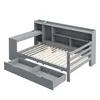 A 3D rendering of a gray wooden bed frame with integrated shelving and a desk. Produktbild-Vorschau