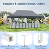 A grey party tent set up outdoors for an event with tables and chairs covered in white cloths. Anteprima dell’immagine prodotto