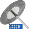 A close-up shot of a diamond cutting disc attached to a metal mandrel, with a package of smaller cutting discs in the foreground. Produktbild-Vorschau