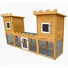 A wooden rabbit hutch designed to look like a castle, shown against a white background. Produktbild-Vorschau