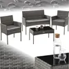 A rattan garden furniture set including a sofa, two chairs, and a coffee table, with water droplets on a textured background.