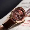 A close-up shot of a men's watch placed on a newspaper. Anteprima dell’immagine prodotto