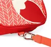 A close-up of a red backpack with a white and red pattern, showing a strap and clasp. Anteprima dell’immagine prodotto