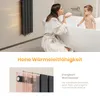 A woman and a baby in a bathroom, with a radiator on the wall. Voir les images du produit