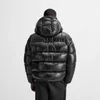 A person wearing a black puffer jacket, viewed from the back. Produktbild-Vorschau