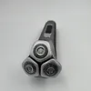 A close-up, top-down view of a Philips electric shaver with three rotating heads, set against a plain white background. Podgląd zdjęcia produktu